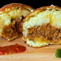 Stuffed Potato Balls with Sofrito Beef · Relleno de pappas. Seasoned mashed potatoes, stuffed with sofrito beef.