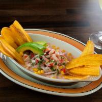 Ceviche de Tilapia · Diced fresh tilapia marinated in lime juice, coconut milk, onions, cilantro, peppers and swe...