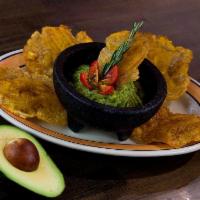 Tostones con Guacamole · Fried green plantains served with fresh guacamole.