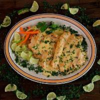 Pollo al Limon · Chicken fillet cooked in a traditional lemon sauce with fresh spices, served with salad, ric...
