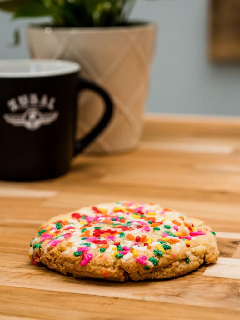 Sugar Cookie with Sprinkles · There are sugar cookies and then there are sugar cookies.  This three inch seasonally colored spectacle is rich in texture and moist beyond what you'd expect.