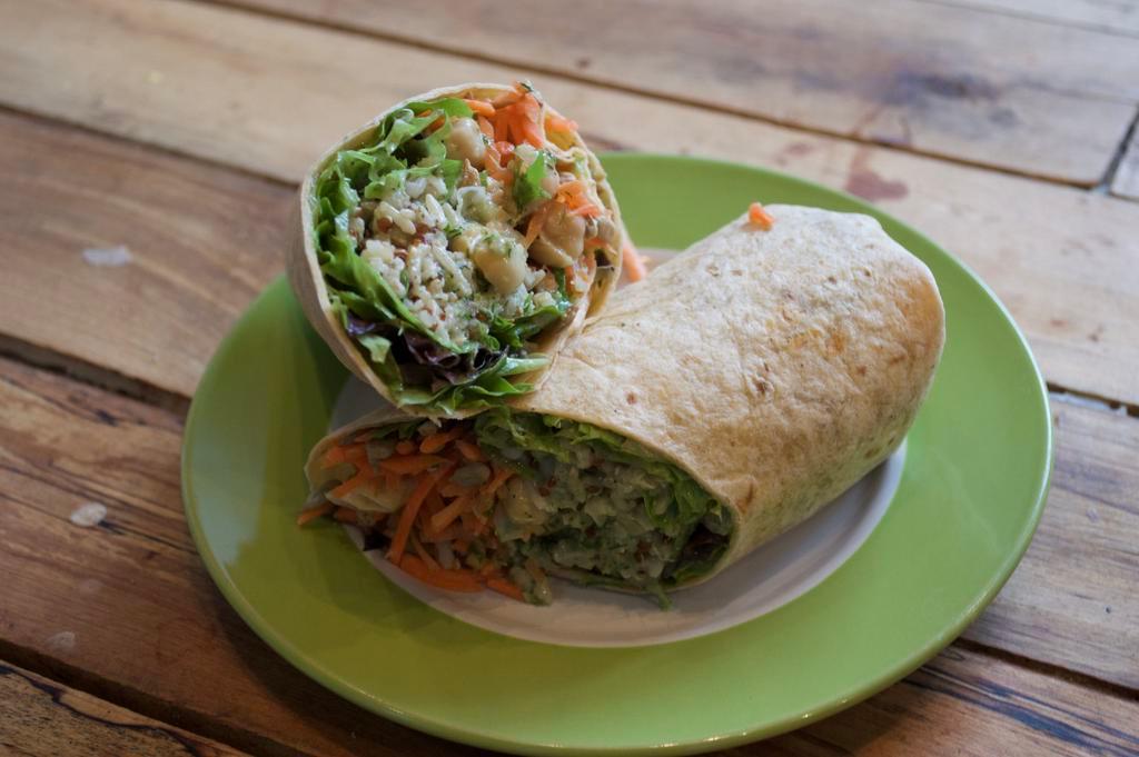 Super Vegan Wrap · Homemade chickpea salad, ancient grains, sunflower seeds, shredded carrots  and mixed greens on sun dried tomato basil wrap.