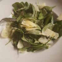 Spinach Caesar Salad · Served with fresh spinach, herb croutons, creamy Caesar and shaved parmesan cheese.