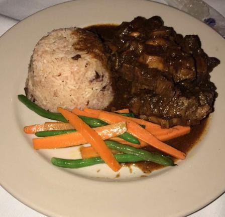Braised Oxtail · Served with rice and peas, sauteed carrots and crisp green beans.
