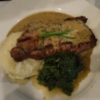 NY Sirloin · Served with roasted garlic mashed potatoes, sauteed spinach and drizzled with a 4 pepper au ...