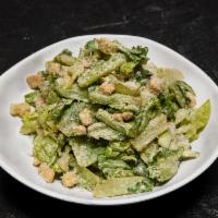 Classic Caesar Salad · Brioche croutons, Parmesan cheese and dressing.