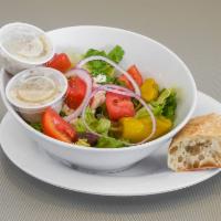 Greek Salad · Romaine, tomato, red onion, feta cheese, pepperoncini, black olives and mediterranean dressi...