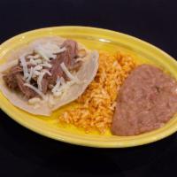 Kids Meat Taco Plate · 1 small taco with meat, rice and beans on the side.