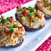 Loaded Potato Skins · Bacon, cheddar and scallions served with sour cream