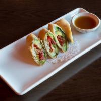 Avocado Rolls · Avocado, sun dried tomato, red onions and cilantro fried in a crispy wrapper served with tam...