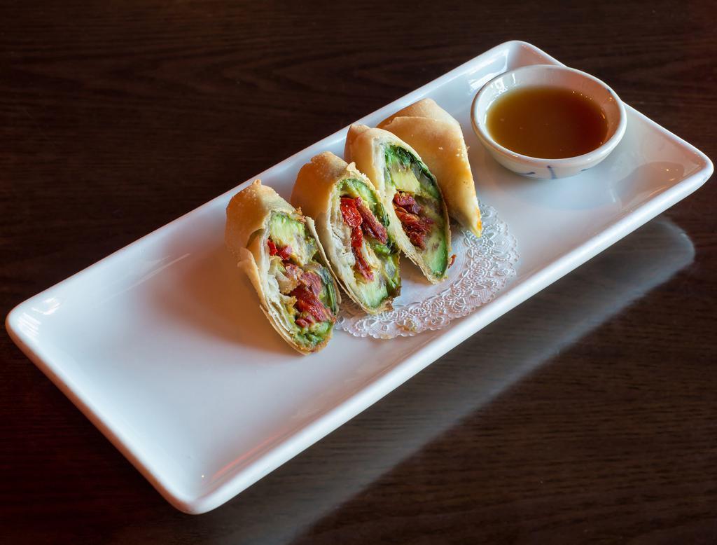 Avocado Rolls · Avocado, sun dried tomato, red onions and cilantro fried in a crispy wrapper served with tamarind dipping sauce.