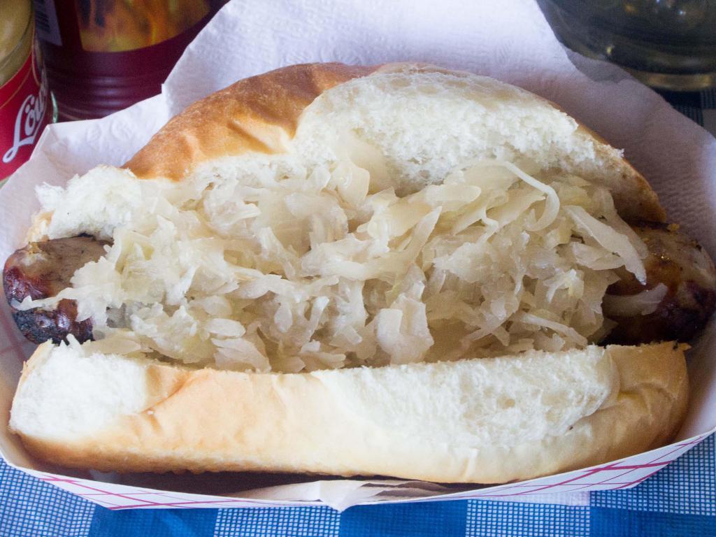 Bratwurst · Bratwurst on the roll, with sauerkraut and grilled onions.
