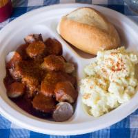 Currywurst Plate · Sliced bratwurst topped with curry sauce. Served with your choice of cold potato salad or wa...