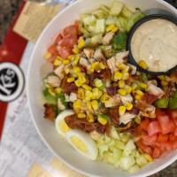 Chopped Cobb Salad · Chopped Greens, Chopped Chicken Breast, Roasted Corn , Avocado, egg, bacon, tomato, red onio...