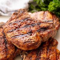 Grilled Pork Chops · Center cut pork chops, served with applesauce, mashed potatoes and vegetable.