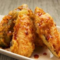 Jalapeno Bay · 4 pcs..Fresh jalapeno stuffed with spicy tuna tempura'd drizzled with sweet sauce on top. Co...