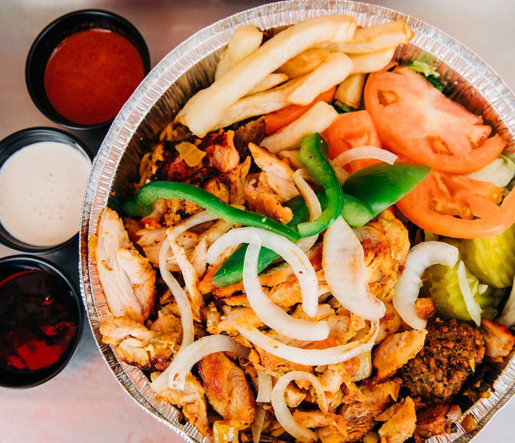 Chicken over Rice · Marinated Chicken with basmati rice, falafel (chickpea fritters), salad, pita bread, green sauce, white sauce, hot sauce, BBQ sauce, and tahini sauce (ground sesame seed sauce).
