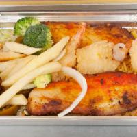 Seafood Combo over Rice · Talapia Fish and Jumbo Shrimps breaded and fried served over rice with salad and french fries.