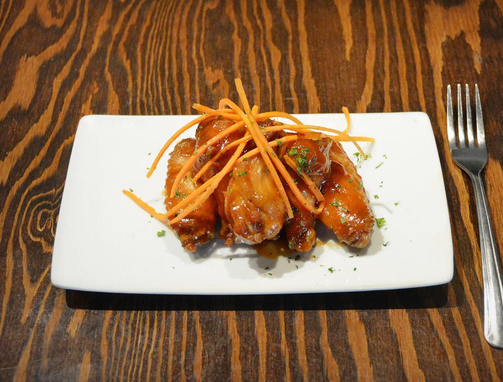 Chicken Wings ·  4 whole wings tossed with your choice of our house-made sauces.
