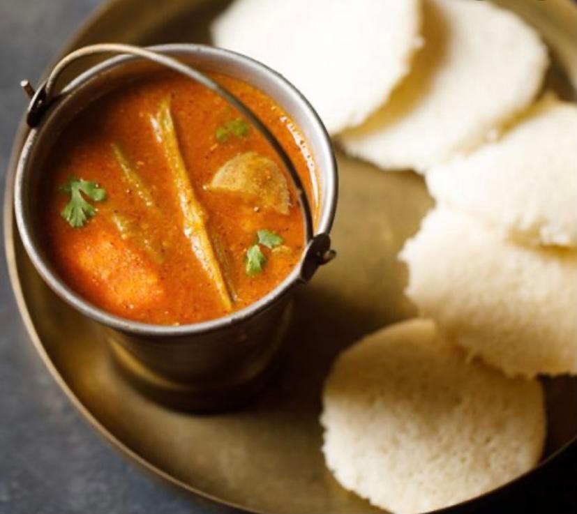 Idli sambar · Idlies are steamed rice cake made of fermented rice batter. It comes with sambhar and spicy coconut chutney.