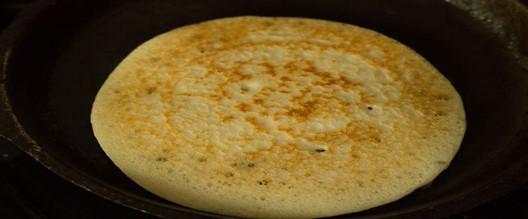 Plain Uttapam · Uttapam is a thick pancake, with toppings cooked right into the batter. Uttapam is sometimes characterized as an Indian pizza.