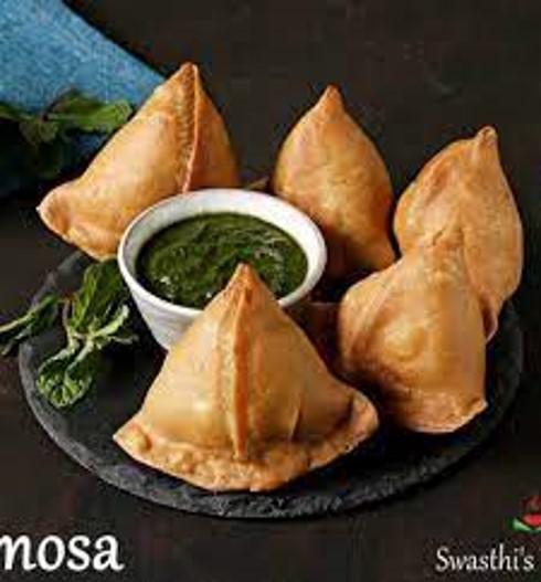 Punjabi Samosa · This Punjabi samosa is as traditional as it gets, potato-pea stuffing and all. It's crispy and flaky and spicy served with tamarin and mint sauce.