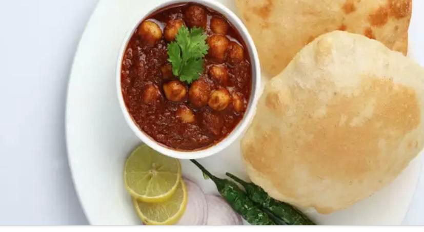 Poori Chole · Fried puffy bread with chickpeas 