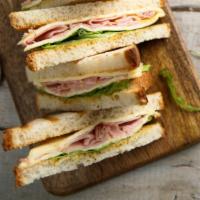 Monte Cristo Panini · Sizzling turkey ham, Swiss cheese, cheddar cheese, lettuce, tomatoes and honey mustard.