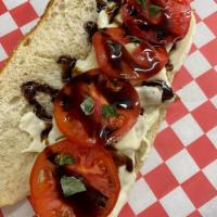 The “Skinny Joey” Cutlet · Cutlet topped with sliced tomatoes, fresh mozzarella, basil 
 and balsamic glaze.