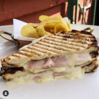 Tosta Mista Sandwich · Portuguese ham and cheese panini. Served with present flavored chips.