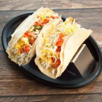 Baja Tacos · 2 corn or flour tortillas, meat, cheese, lettuce and pico de gallo.