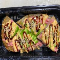 Spicy Tuna pizza · Crispy pancake top with spicy tuna , sesame seeds avocado and spicy mayo ,eel sauce and masa...