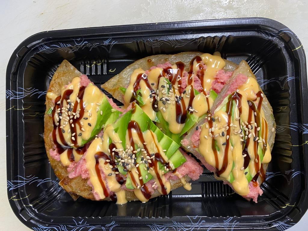 Spicy Tuna pizza · Crispy pancake top with spicy tuna , sesame seeds avocado and spicy mayo ,eel sauce and masago.