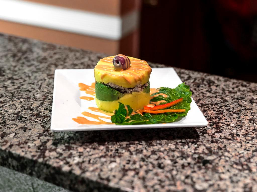Causa Limena · Cold mashed potato filled with chicken or tuna.