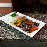 Lomo Saltado · Sauteed steak with tomato, red onions and served with rice and french fries.