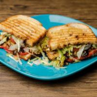 BBQ Chicken Panini · Hand pulled savory chicken on a bed of provolone, topped with tomato, BBQ sauce, and shredde...