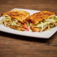 BBQ Pulled Pork Panini · Zesty BBQ dressed pulled pork, topped with melty pepper jack, tomato, and shredded lettuce.