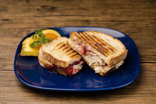 Turkey Cranberry Panini · Thanksgiving's perfect pair meets the cheese or their dreams: Turkey, cranberry and havarti on Italian bread.