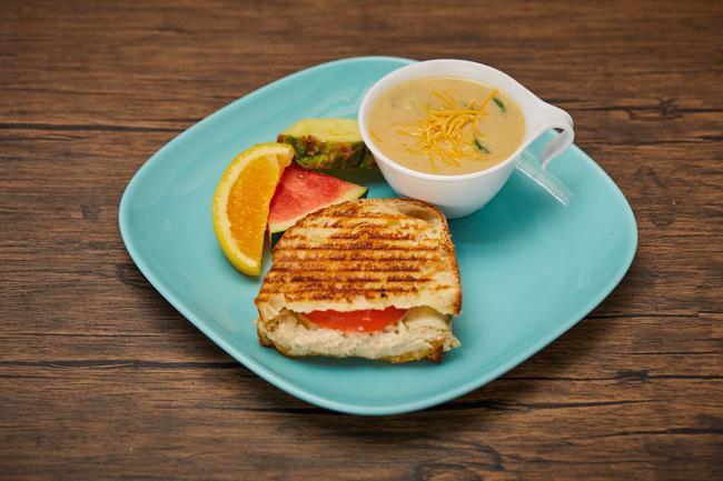 Half Sandwich and Cup of Soup · A perfect match for a quick or light lunch! Your choice of a half panini and a 8oz cup of soup. Add a drink to make it a full meal!