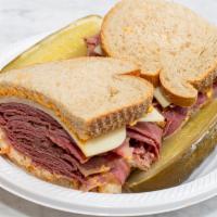 Corned Beef Special Sandwich · The best beef in town. Made with hot lean corned beef, Swiss cheese, coleslaw, and Russian d...