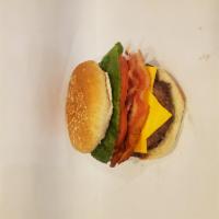 Bacon Cheeseburger · Homemade burger with bacon and American cheese on hamburger bun.
