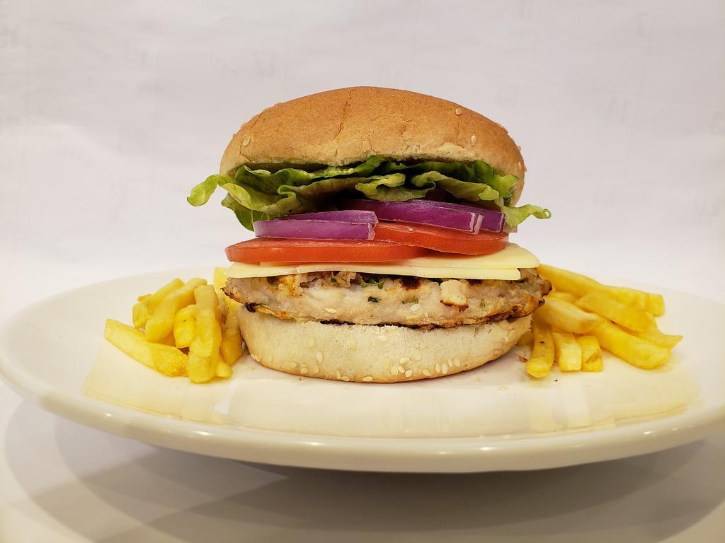 Fish Burger · Homemade basa fish burger on hamburger bun.
