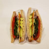 A. Delight Garden Sandwiches  · Tomato, alfalfa sprouts, peppers, cucumbers, red onion, carrots, mix greens, avocado on whea...