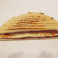 The Combo Panini · The combo pastrami corn beef, provolone cheese, lettuce, tomato, mustard, house dressing on ...