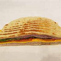 Toasted Monte Cristo Panini · Toasted monte cristo, layers of ham, smoked turkey, Swiss, cheddar, lettuce, tomato and hone...