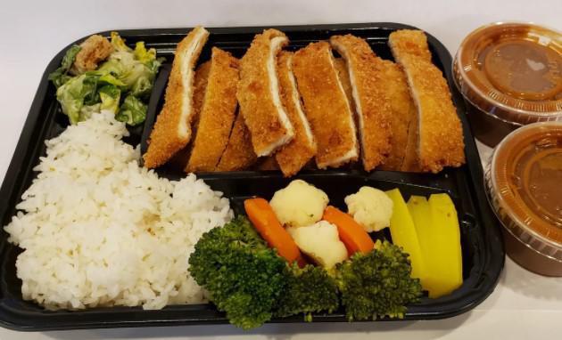Chicken Katsu Bento · Chicken cutlet served with rice and vegetables.