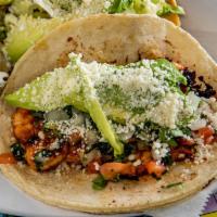 Grilled Shrimp Taco (Order of 3) · Topped with pico de gallo, avocado, and Cotija cheese. Tacos topped with fresh onions and, c...