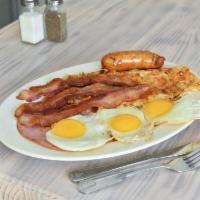 3 Eggs Deluxe · Served with ham, bacon and sausage with home fries and toast.