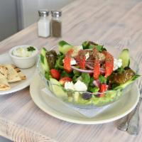 Greek Salad  · Romaine, feta, olives, tomato, cucumbers, red onion and dolmadakia.Served with toasted pita.