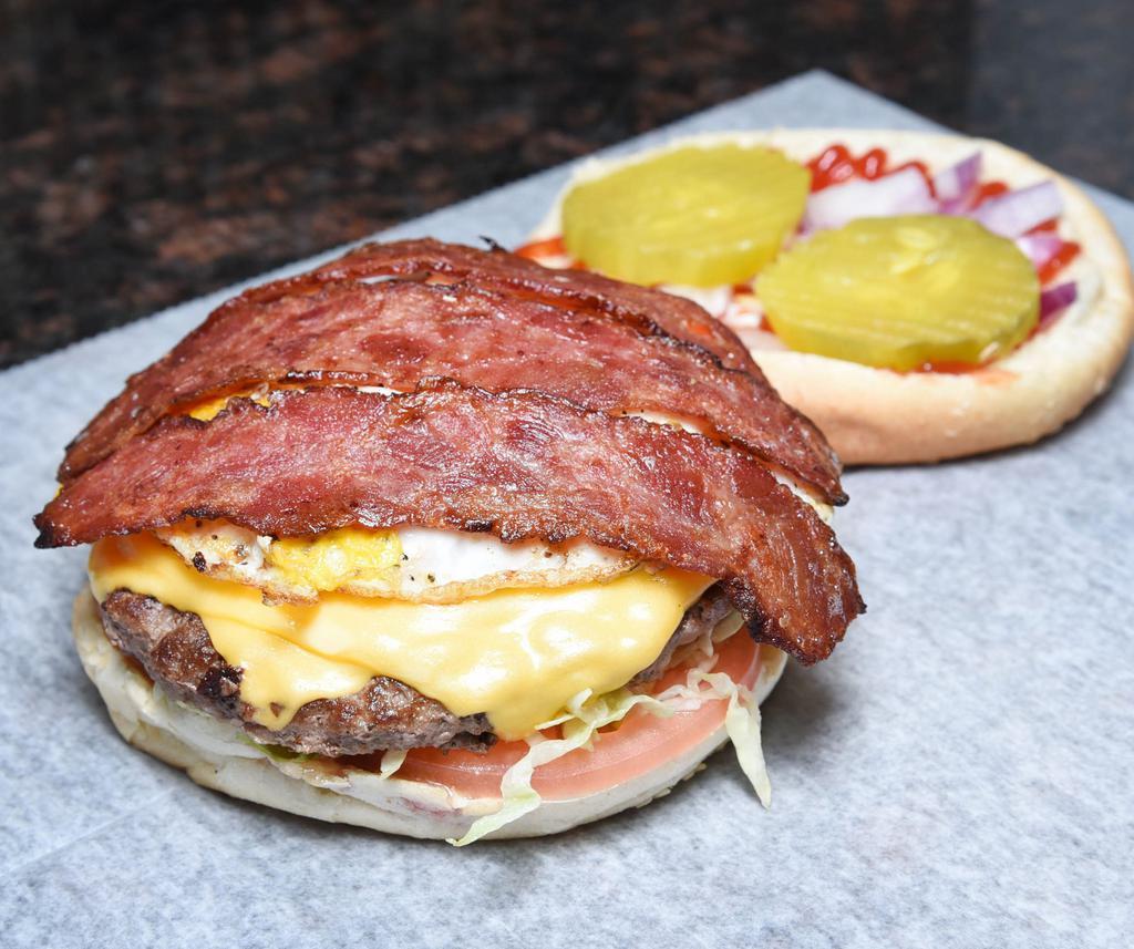 Texan Burger deluxe  · With cheddar and bacon. 1/2 lb. of quality sirloin beef.